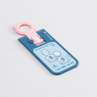 A blue and pink rectangular key for the Philips HeartStart FRx AED