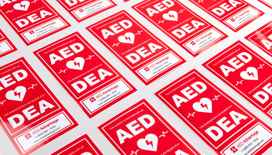 A collage of large red rectangular decals that adhere to the side of AED storage cabinets to increase their visibility