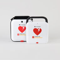A white and red LIFEPAK CR2 AED standing next to its semi-rigid carry case