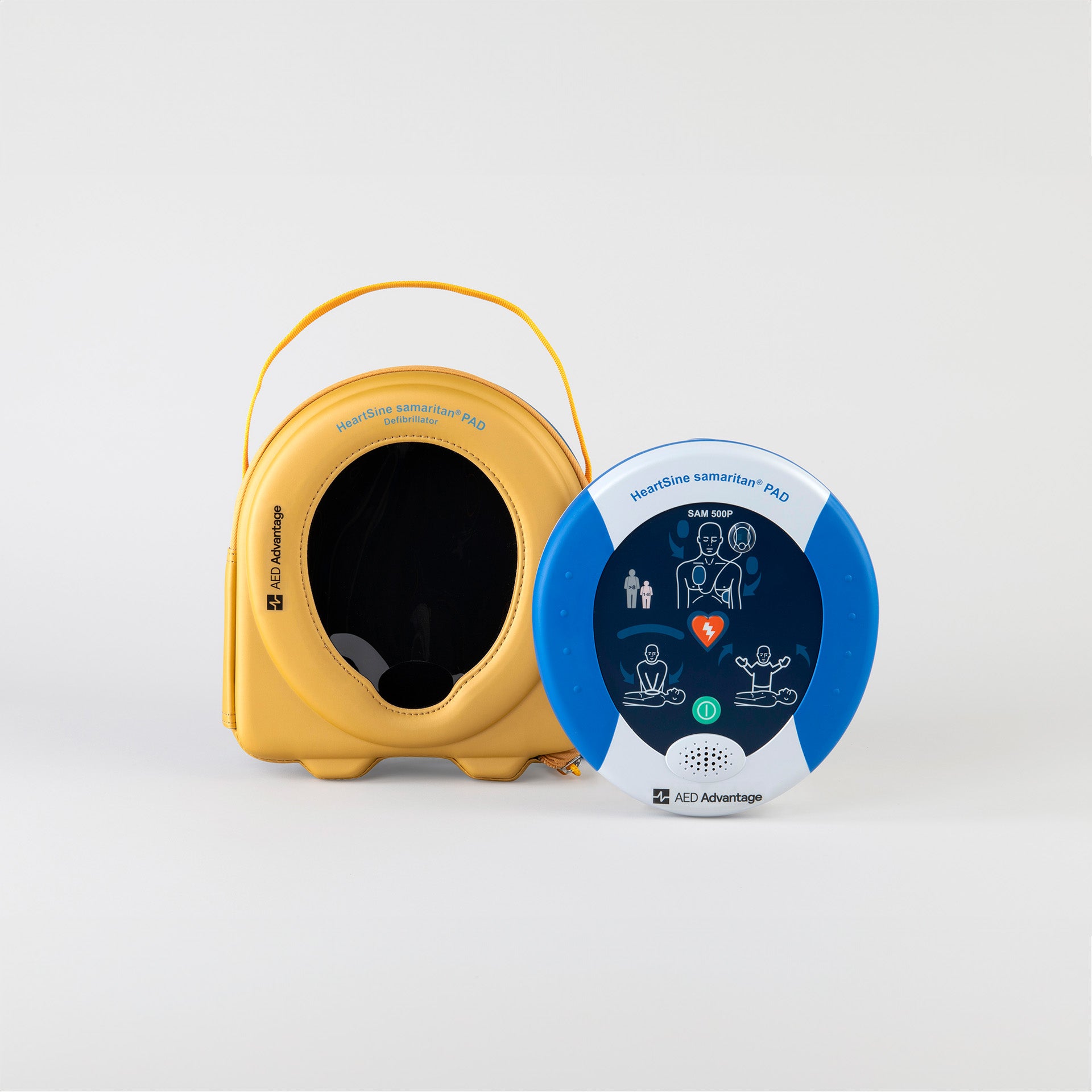Heartsine 500P AED sitting upright on grey backdrop with semi-rigid carry case sitting on the left side