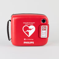 A bright red Philips defibrillator carrying case.