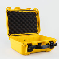 An open bright yellow hard AED case with black foam padding inside