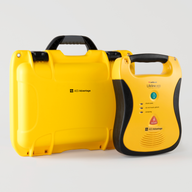 A yellow and black Defibtech Lifeline AED with a bright yellow hardshell carry case