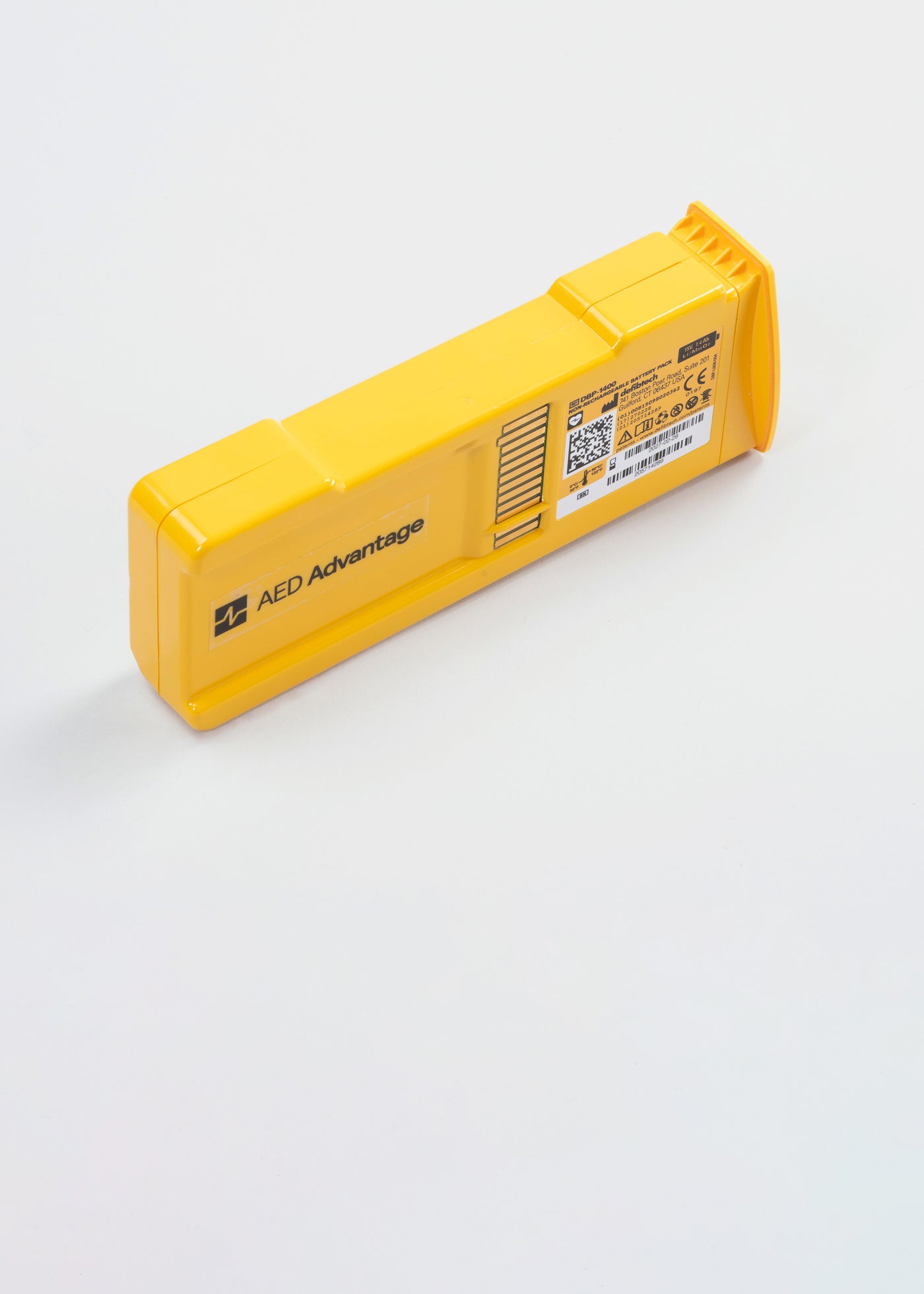 A rectangular yellow defibtech lifeline aed battery pack