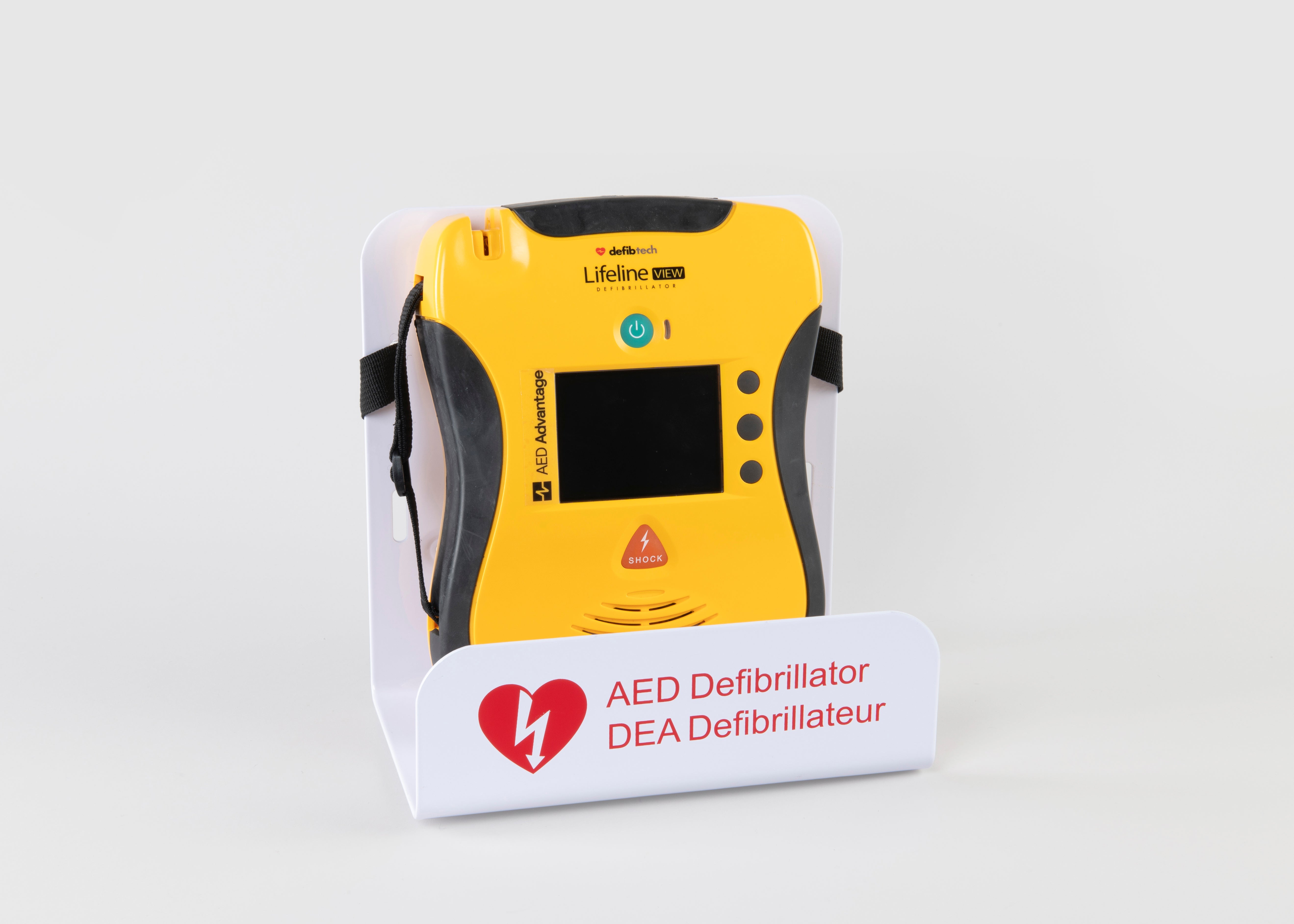 A black and yellow Lifeline VIEW AED displayed in a white metal wall mount bracket