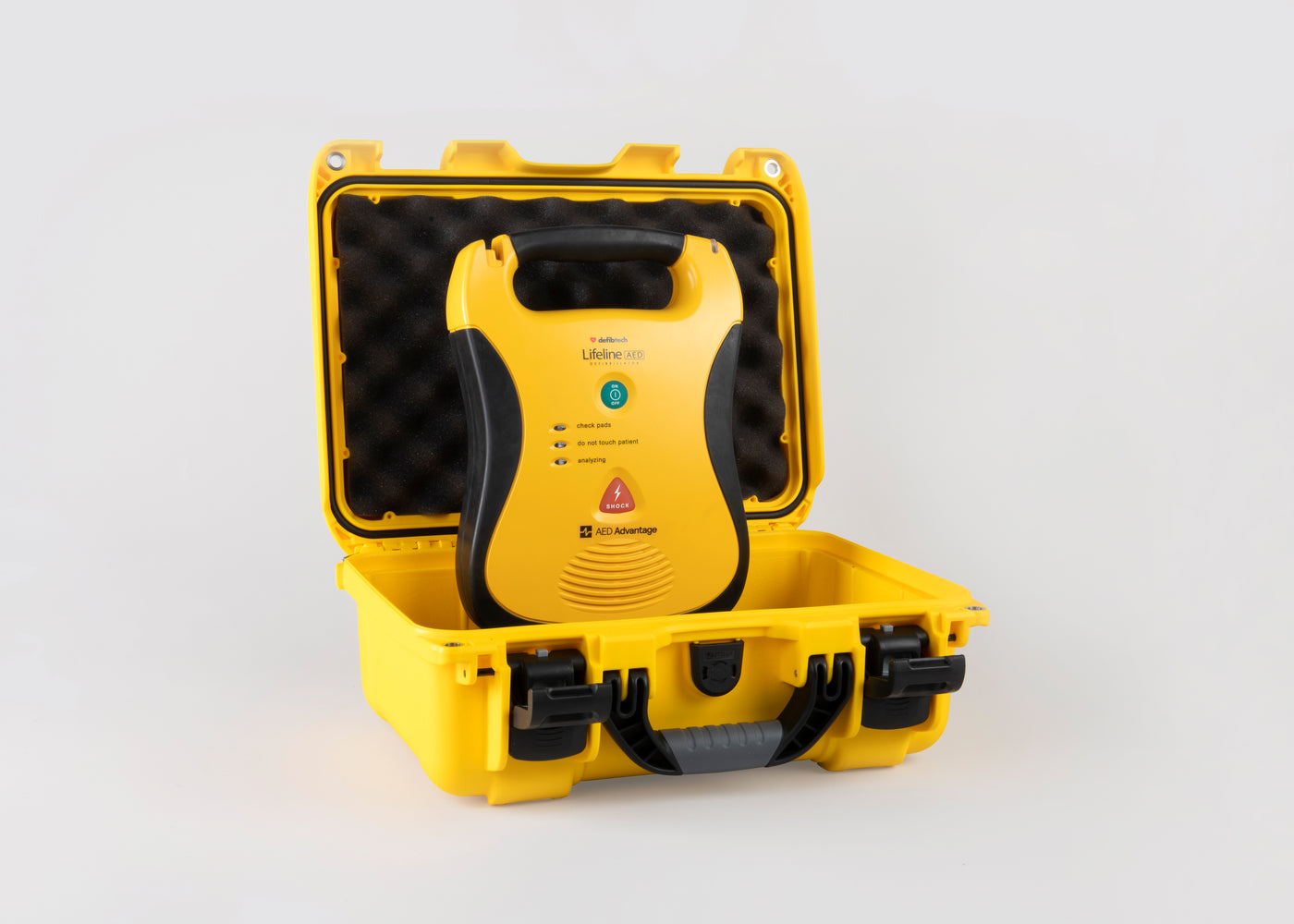 A yellow and black Defibtech Lifeline AED with a bright yellow hardshell carry case