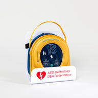 A HeartSine 500P AED in its yellow carry case displayed in a white wall mount bracket