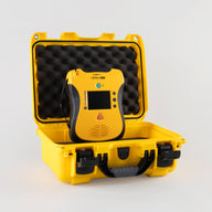 A yellow and black Defibtech Lifeline VIEW AED with a bright yellow hardshell carry case