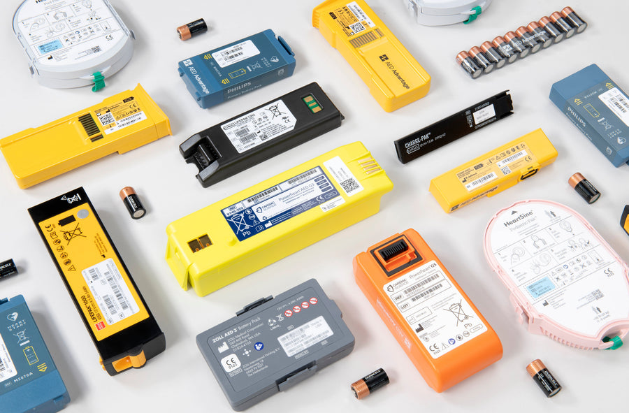 A collage of AED batteries of various colors, sizes, and shapes