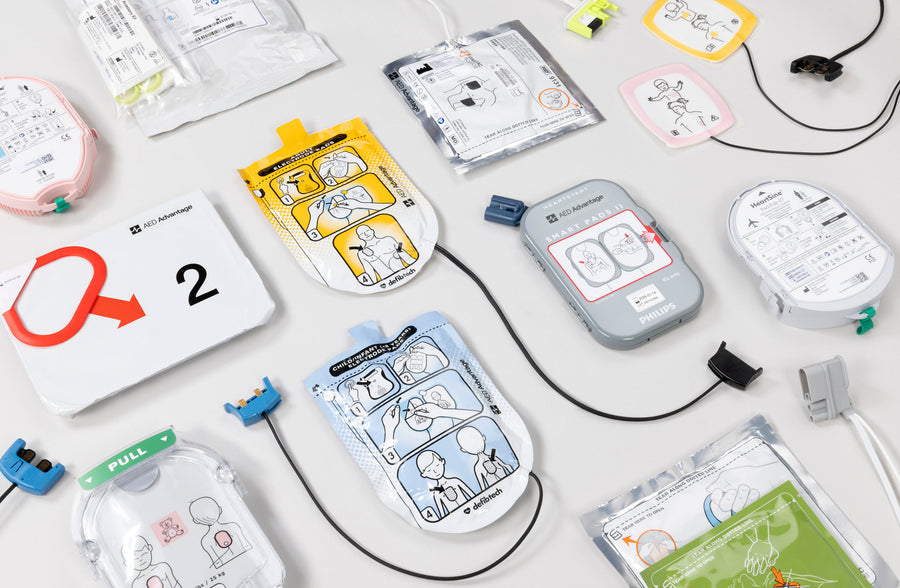 A collage of defibrillator electrode pads of various colours and shapes