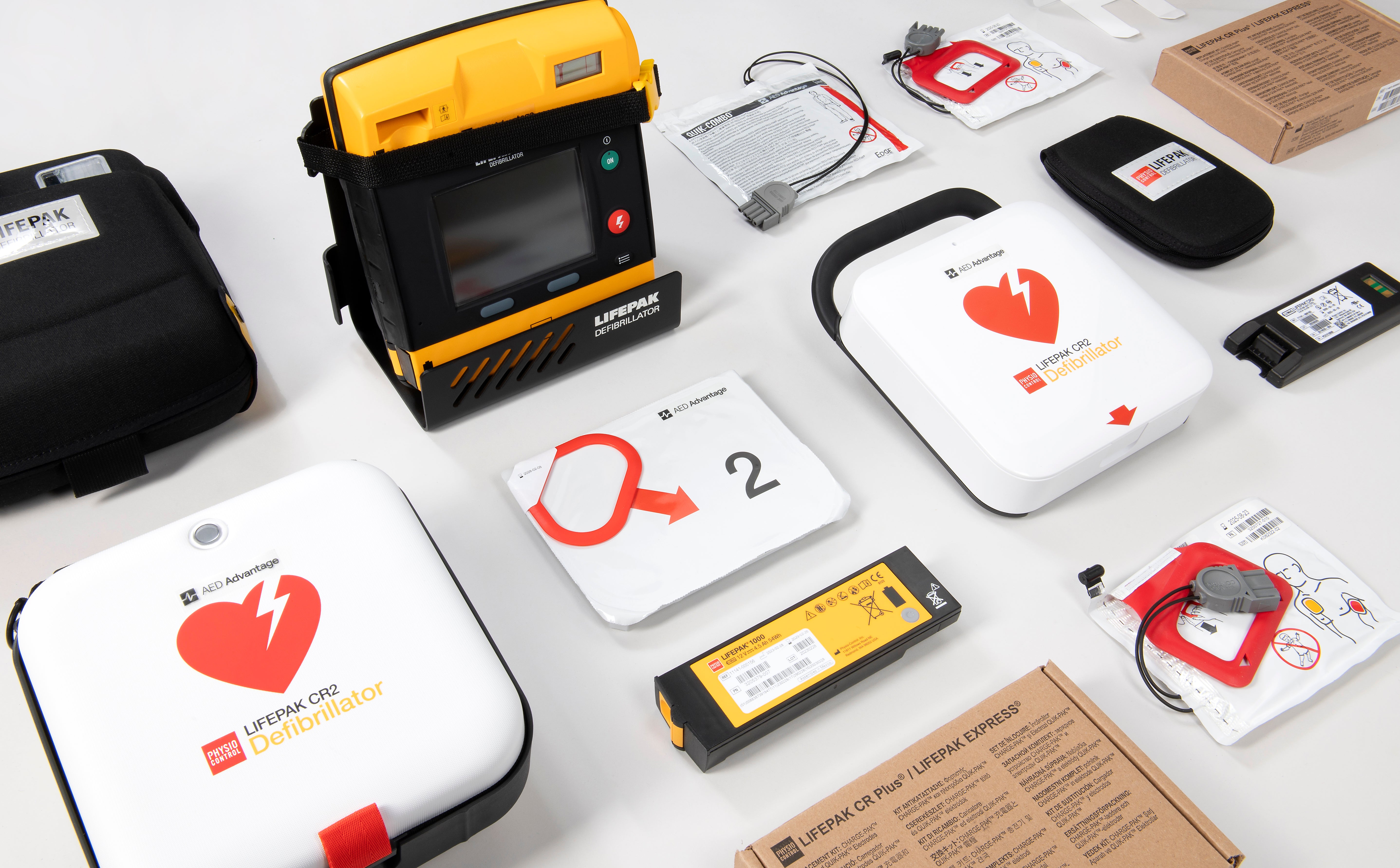 A collage of LIFEPAK AEDs and their accessories of various colours. 