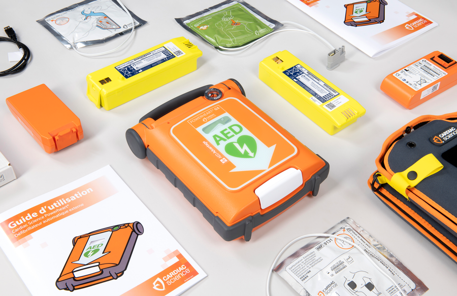 A collage of Cardiac Science AEDs and their accessories
