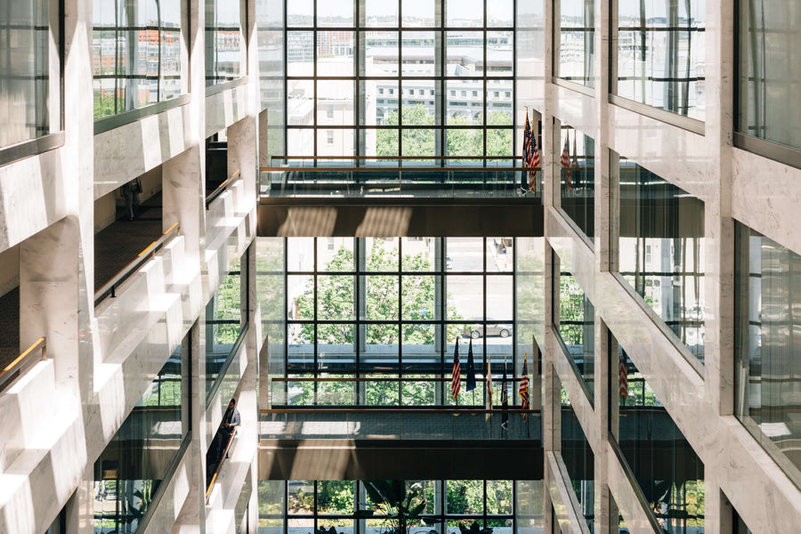 A view of several floors of a large government building with glass walls