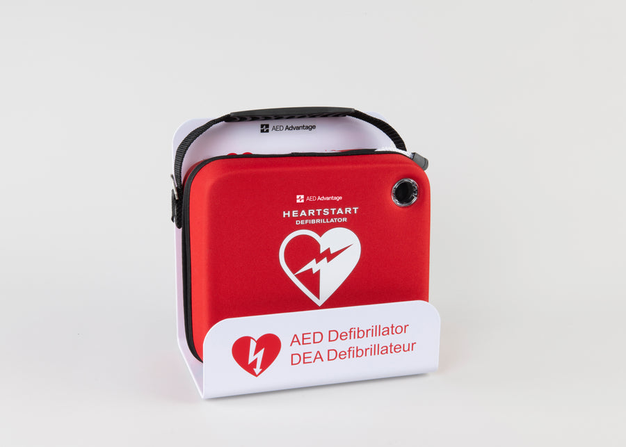 A bright red Philips OnSite AED in a white wall mount bracket