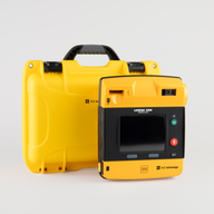 A black and yellow LIFEPAK 1000 AED machine with a bright yellow hardshell carry case