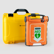 An orange Powerheart G5 AED standing next to a bright yellow hardshell carry case