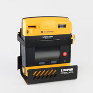 A yellow and black LIFEPAK 1000 AED machine strapped into a black metal wall mount bracket