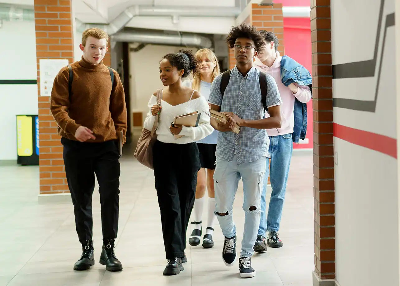 Students walking down a hallway,