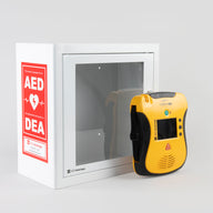A yellow and black Defibtech Lifeline VIEW AED standing in front of a white metal cabinet with red decals