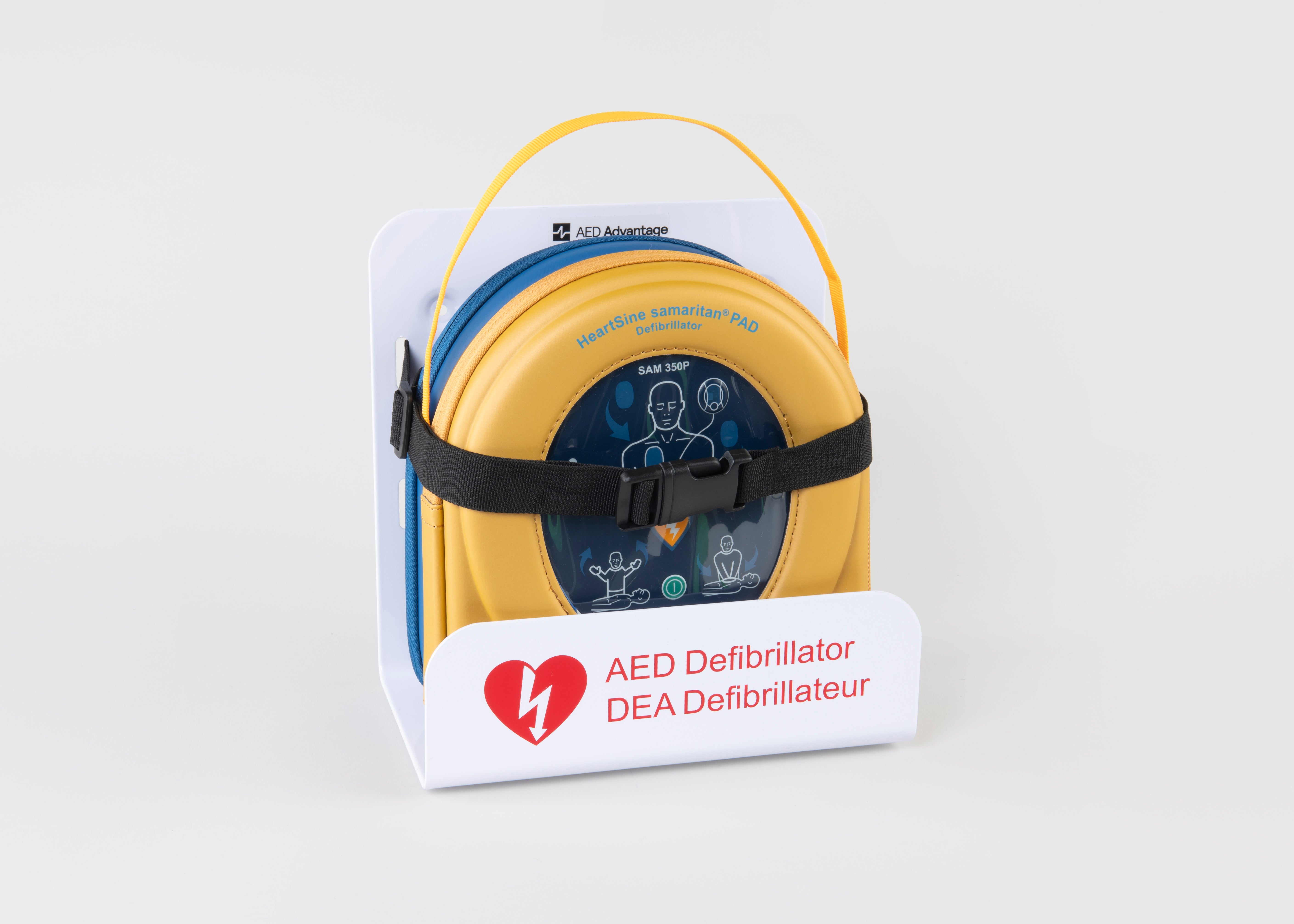 A HeartSine 350P AED in its yellow carry case strapped into a white wall mount bracket