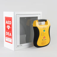 A yellow and black Defibtech Lifeline AED standing in front of a white metal cabinet with red decals