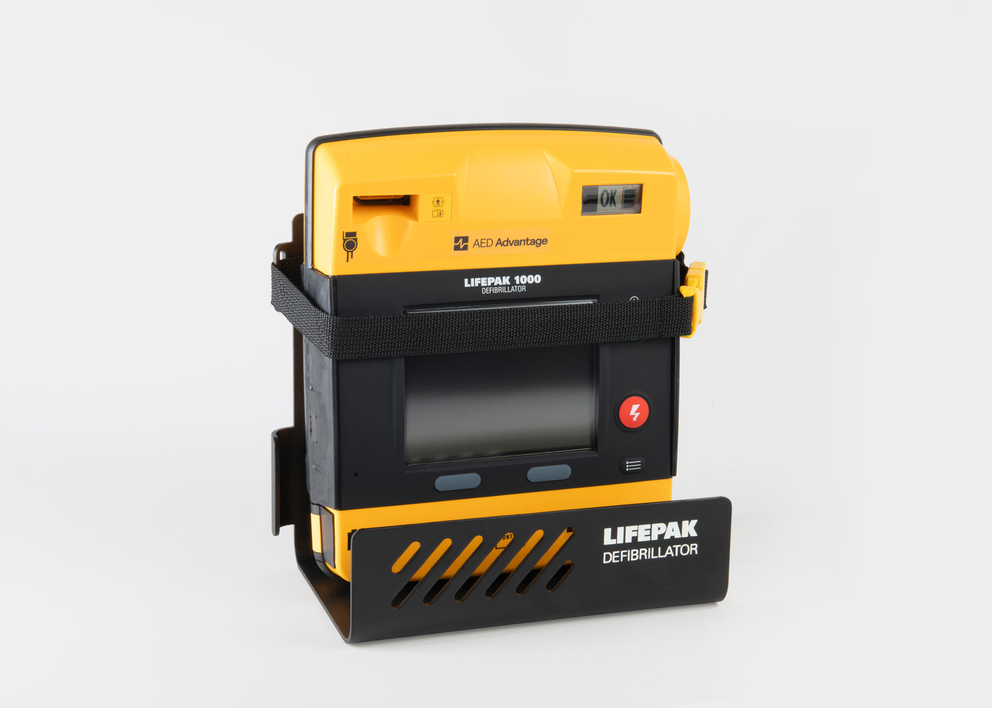 A yellow and black LIFEPAK 1000 AED machine strapped into a black metal wall mount bracket