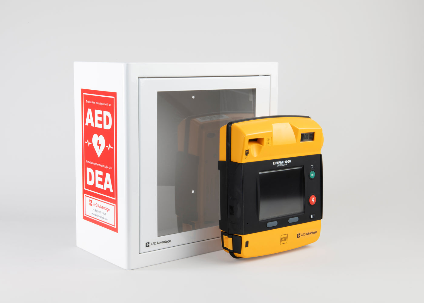 A black and yellow LIFEPAK 1000 AED standing in front of a white metal cabinet with red decals