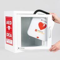 A white and red LIFEPAK CR2 AED machine being retrieved by hand from a white metal cabinet with red decals