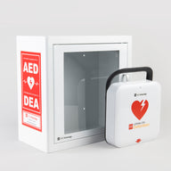 A white and red LIFEPAK CR2 AED machine standing in front of a white metal aed cabinet with red decals