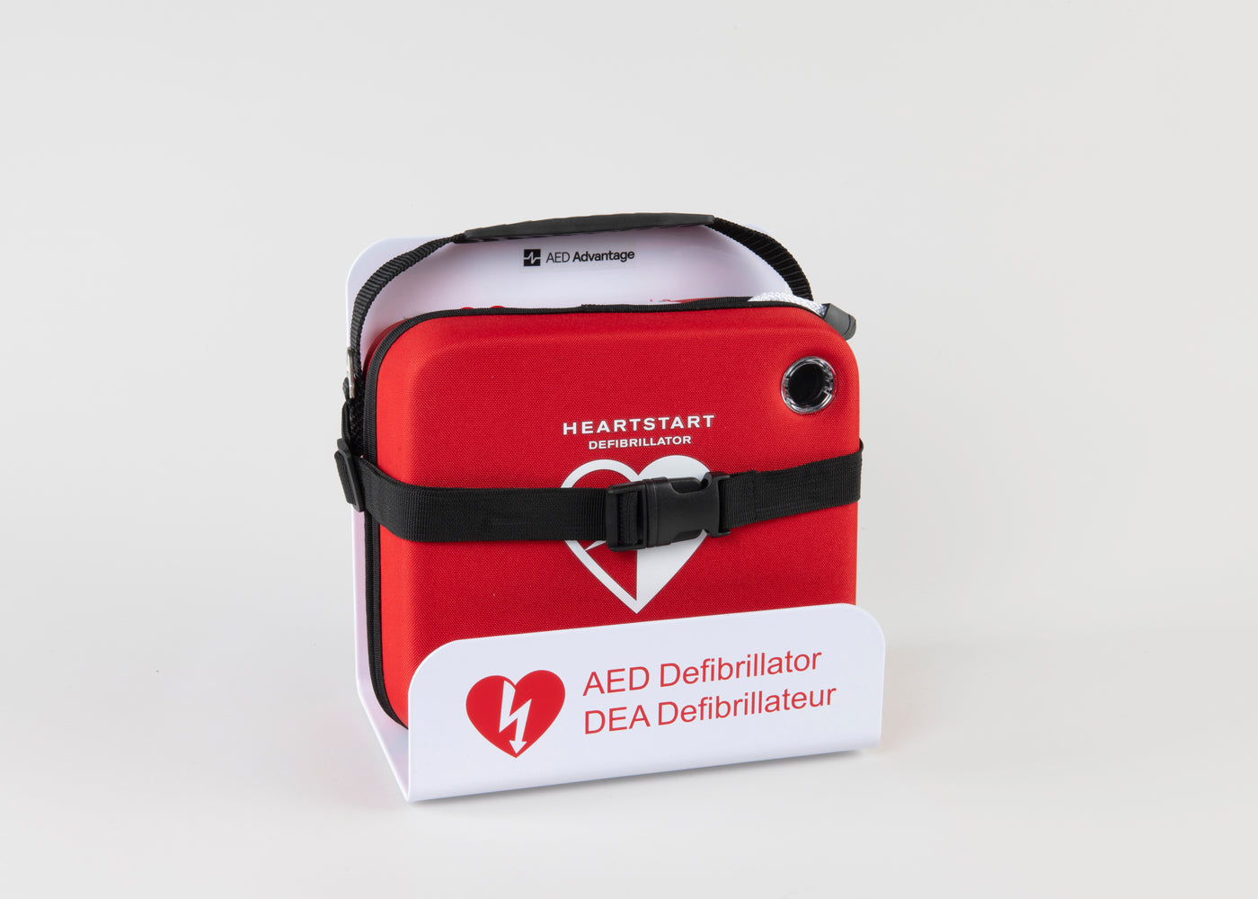 A Philips OnSite AED in a bright red carry case strapped into a white metal wall mount bracket