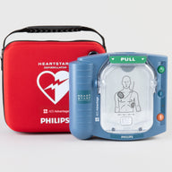 A blue Philips OnSite AED standing nexto its bright red carry case