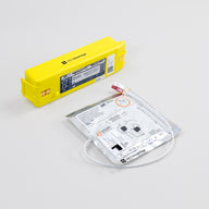 White electrodes package and bright yellow battery pack for the Powerheart G3 defibrillator