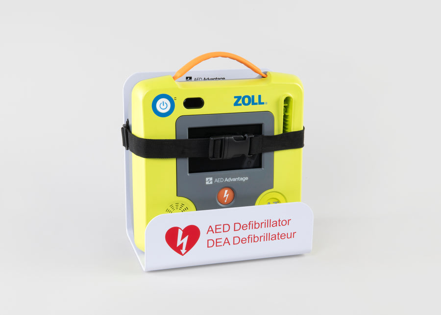 A green ZOLL AED 3 machine strapped into a white metal wall mount bracket