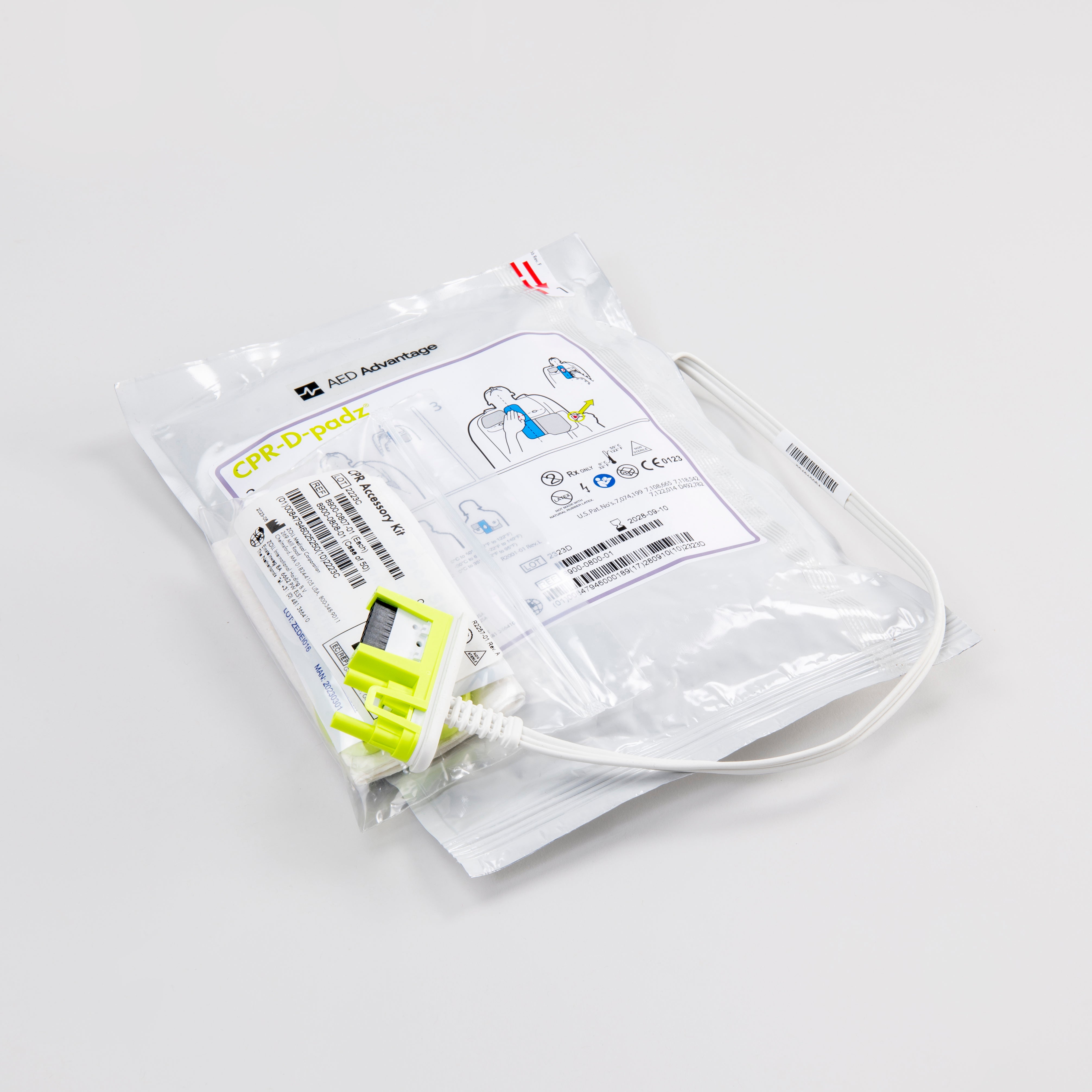 ZOLL AED Plus adult electrodes encased in a white foil package with a white connector cord