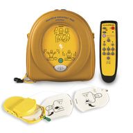 A yellow HeartSine training AED inside its carrycase alongside its remote and pads cartridge