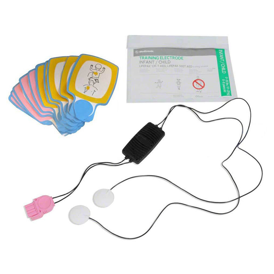 A set of AED training electrodes, cable connectors, and their white foil pouch